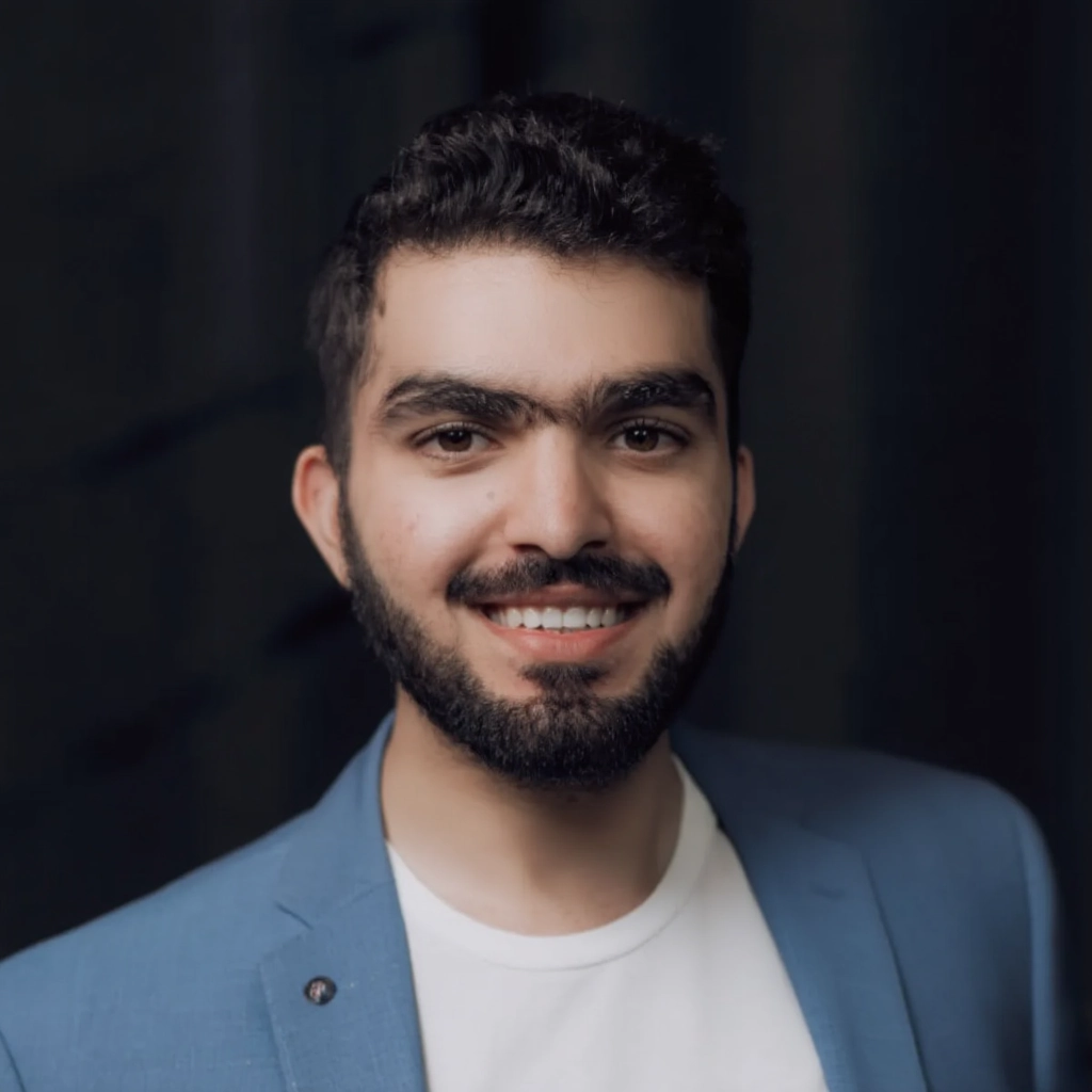 Hussain Abdul Rauf Jatoi smiling in light blue jacket
